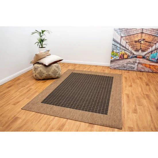 Suva black coffee rug on hardwood flooring. 