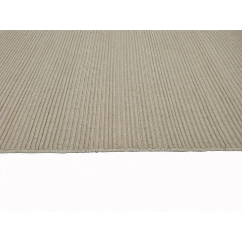 Zoomed-in view of the Zalia Rug's handloomed weave, showcasing the traditional techniques and craftsmanship.