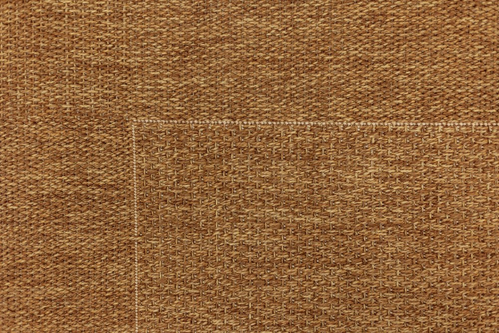 Detailed close-up of the Noosa Rug's Outdoor Range in Natural, emphasizing the fine texture and durable quality of the material, suitable for high-traffic areas.