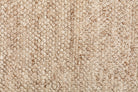 Handwoven Avenue Rug in Beige, highlighting its luxurious and eco-friendly design, perfect for adding a warm touch to modern interiors.
