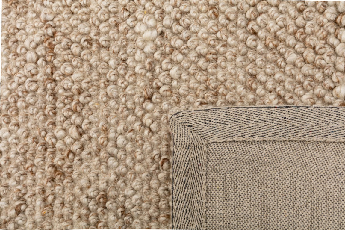 Close-up of the Avenue Beige Rug, emphasizing its plush pile and intricate weaving, reflecting superior craftsmanship and quality.