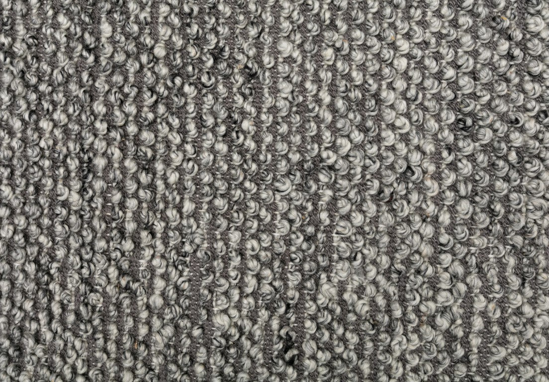 Close-up of the Avenue Rug in Shale, highlighting its wool-like texture and soft feel, handwoven in India, perfect for adding a touch of sophistication to any room.