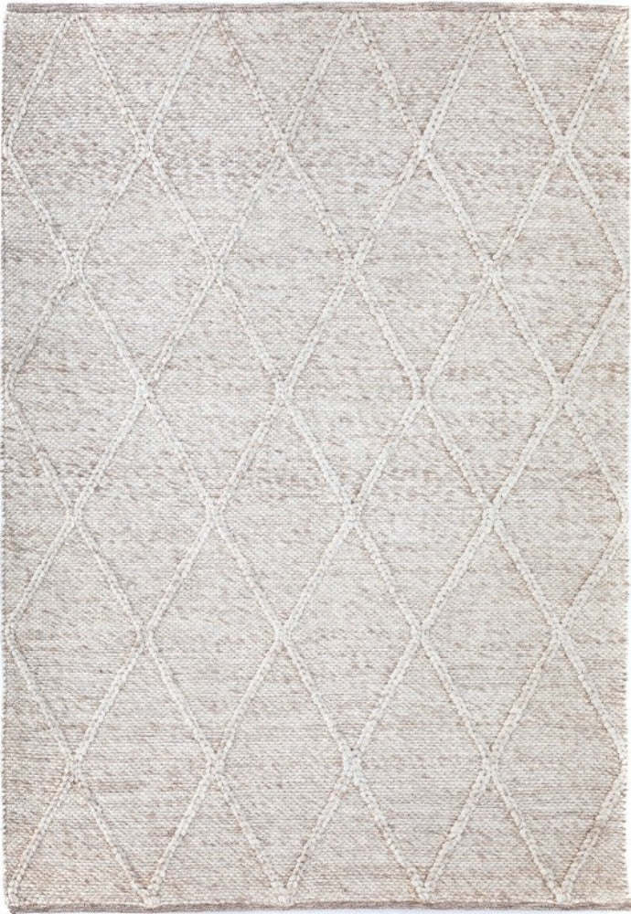 Beige Colombo rug with braided diamond pattern, hand-woven from New Zealand wool, showcasing intricate craftsmanship and a luxurious, plush texture available at Noosa Rugs.