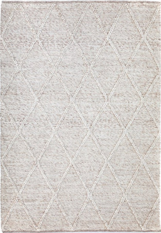 Beige Colombo rug with braided diamond pattern, hand-woven from New Zealand wool, showcasing intricate craftsmanship and a luxurious, plush texture available at Noosa Rugs.