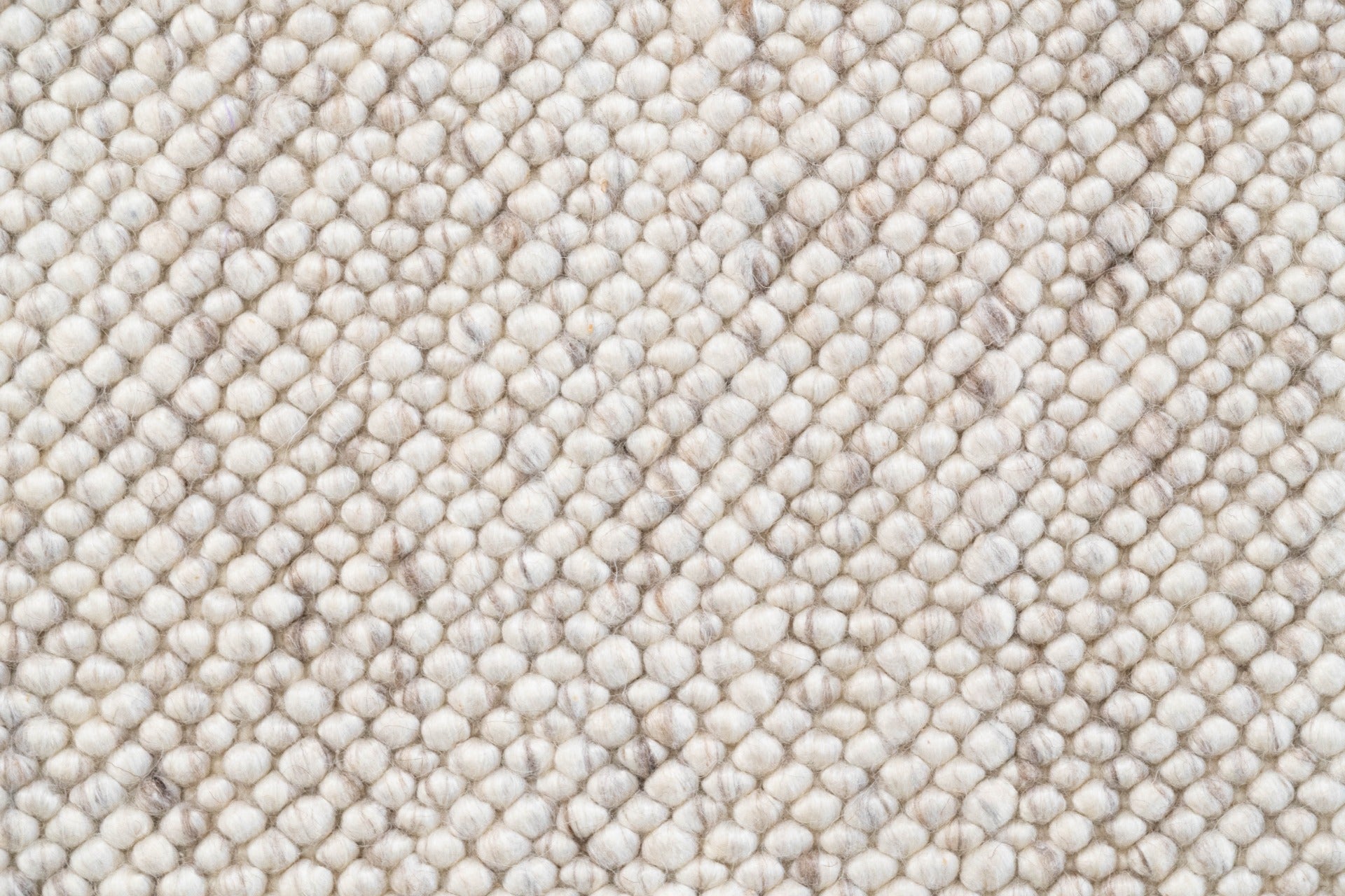 Close-up view of the LUNAR Rug in Almond, highlighting the fine craftsmanship and durable, plush wool material, ideal for high-traffic areas.